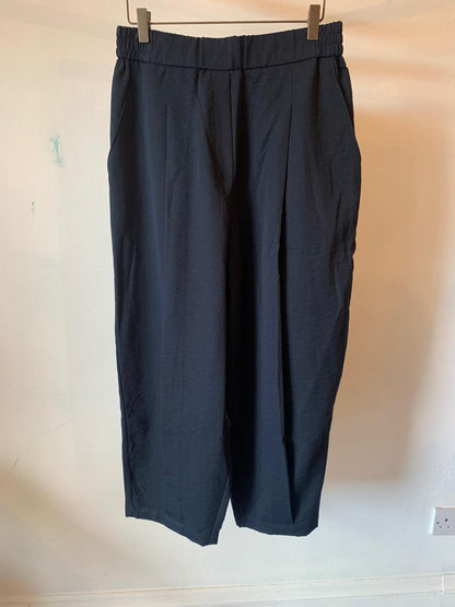 Tapered Pleated Trousers